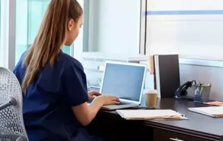 Technolgist on computer.