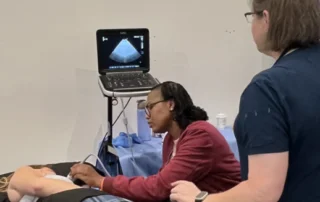 Ultrasound tech using sanitized gel.